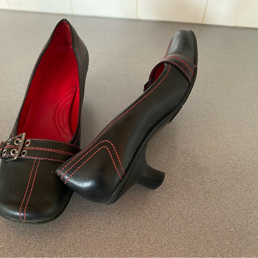Red and black shoes with a different style of heel. Leather uppers